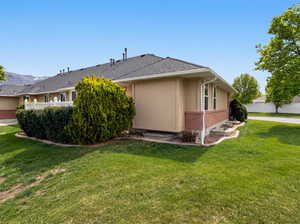View of home's exterior featuring brick siding