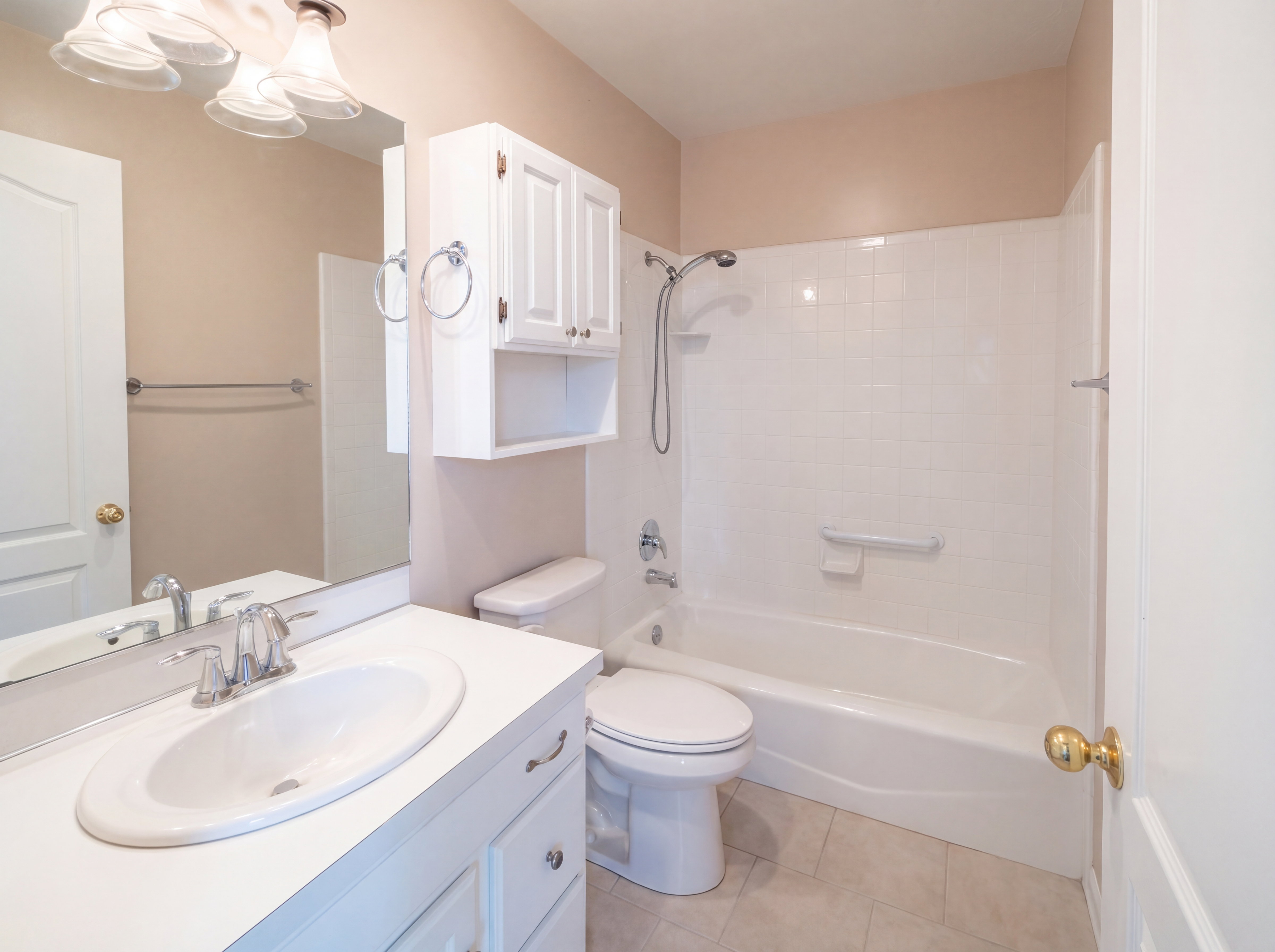 Full bath with vanity, light tile patterned floors, and shower / bathtub combination