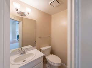 Bathroom featuring vanity and toilet