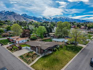 Aerial view of residential area featuring mountains