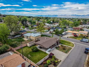 Aerial view of residential area featuring a mountain backdrop