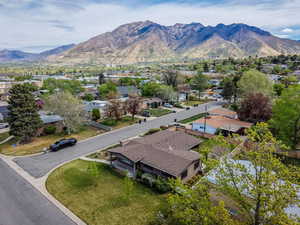 Aerial view of residential area featuring a mountainous background