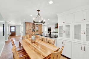 Dining room with baseboards and hanging lights