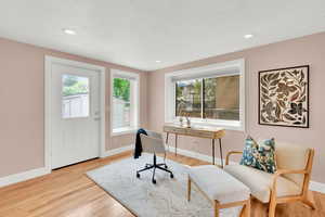 Bedroom with light wood-style floors and recessed lighting