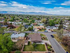 Aerial view of residential area featuring mountains