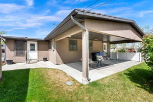 Rear view of property featuring a patio area and stucco siding