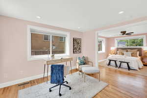 Bedroom with light wood-type flooring and recessed lighting