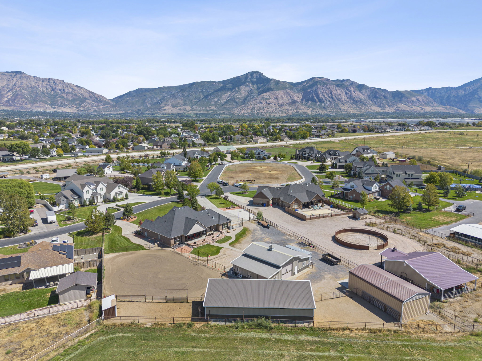 Aerial perspective of suburban area with a mountainous background