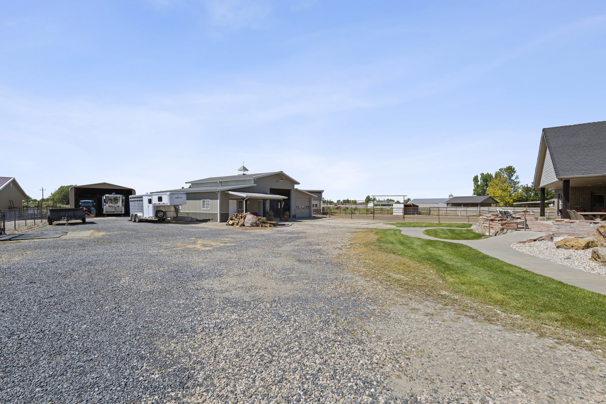 View of dirt / gravel road featuring a gated entry