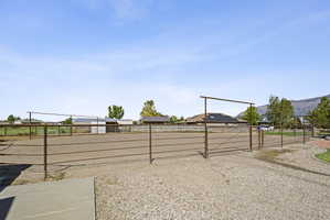 View of yard with an enclosed horse arena