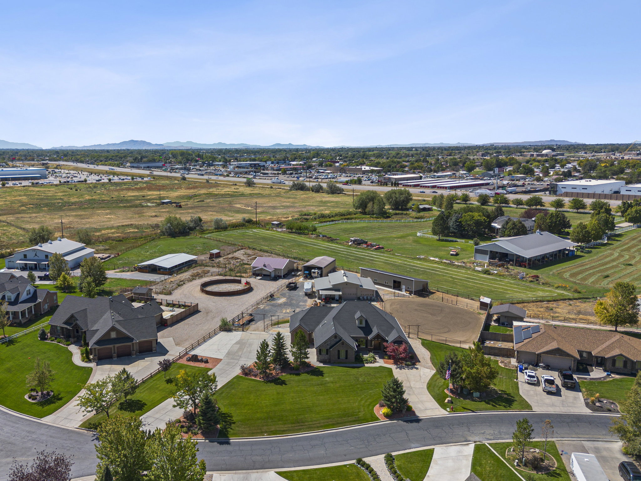 Aerial perspective of suburban area featuring a mountainous background