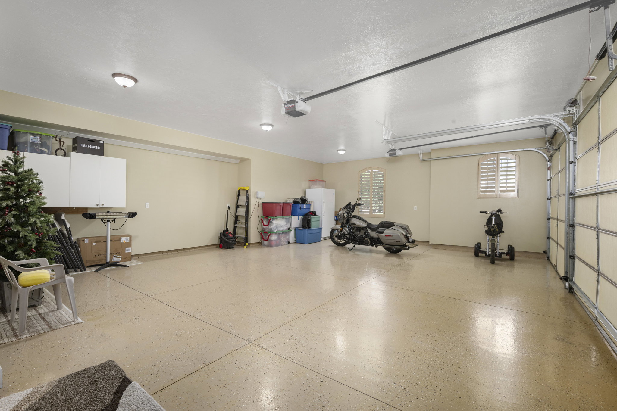 Garage featuring freestanding refrigerator