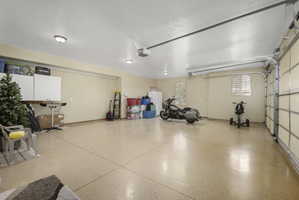 Garage featuring freestanding refrigerator