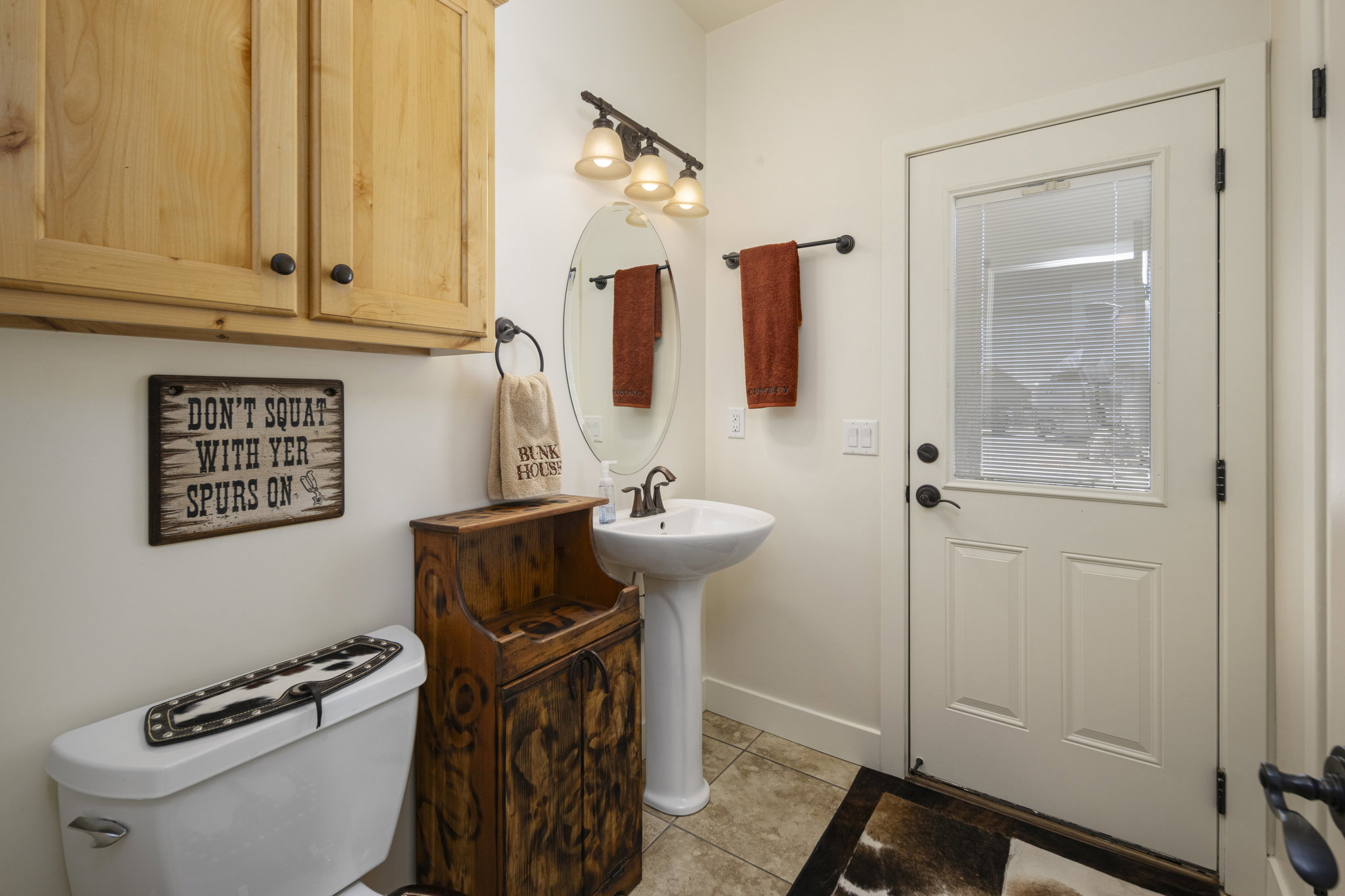 Bathroom featuring toilet and light tile patterned floors