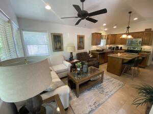 Living room featuring a ceiling fan and recessed lighting