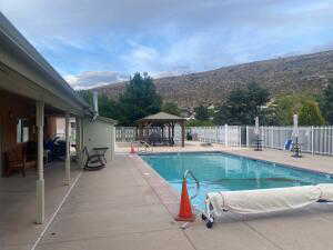 Community pool featuring a patio area and a gazebo