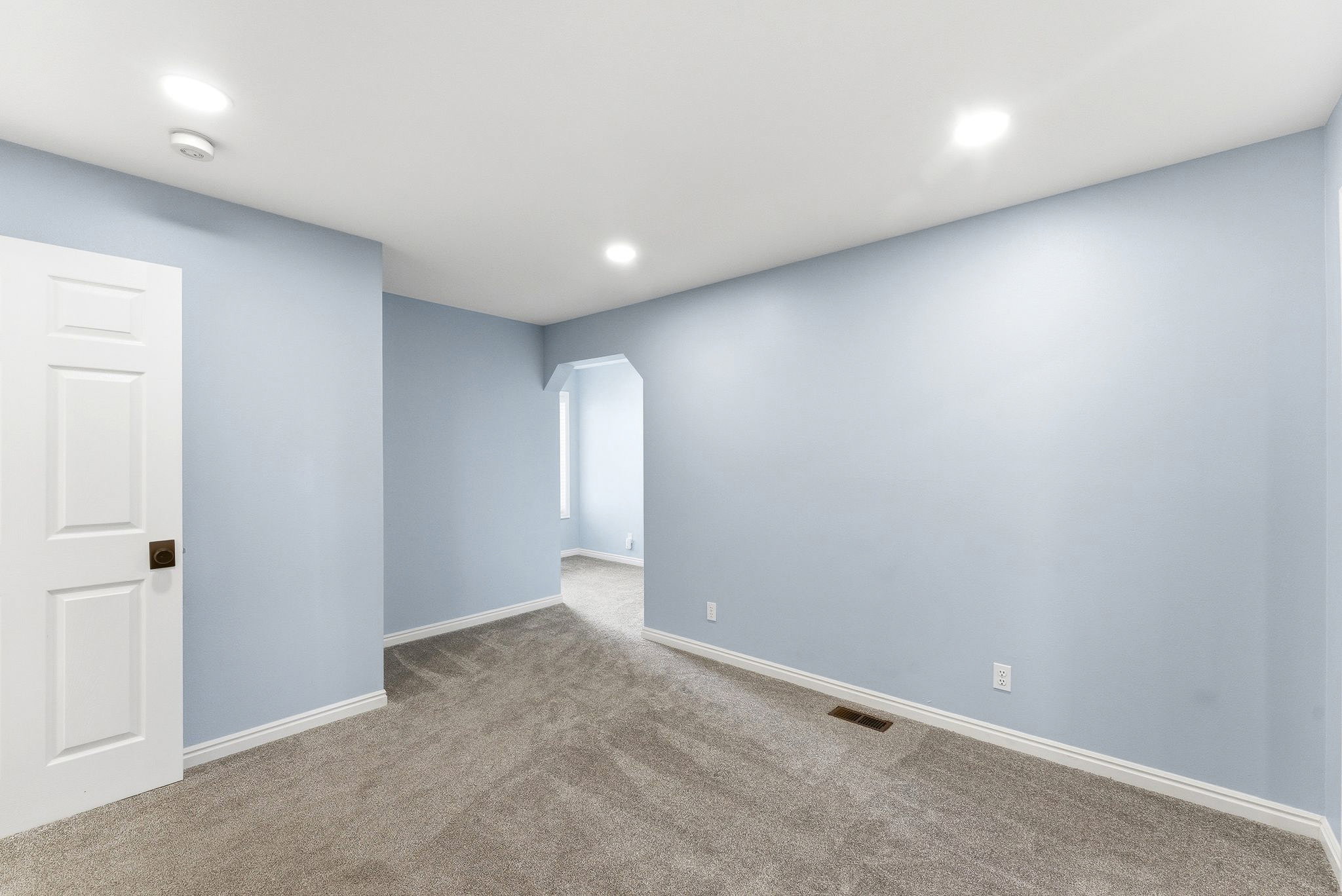 Generous bedroom layout with an extended area that works well as a workspace, reading nook, or additional living space.