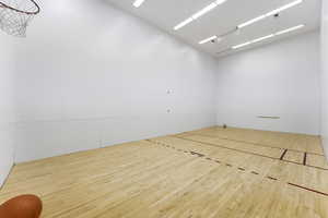 Indoor sport court in Swiss Oaks community with open floor space for recreation and activities