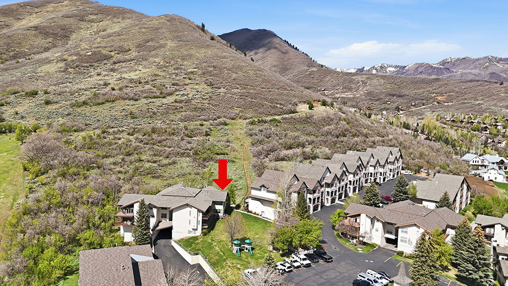 Swiss Oaks real estate drone view showing condo buildings, parking, and landscaped grounds