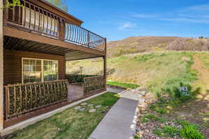 View of yard featuring the deck with mountain view