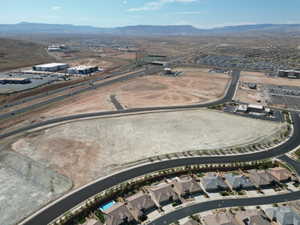 Aerial view of property's location with a mountainous background