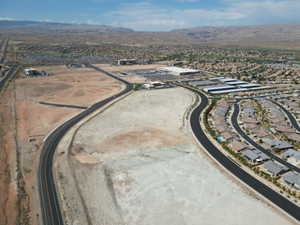 View of property location with mountains and nearby suburban area