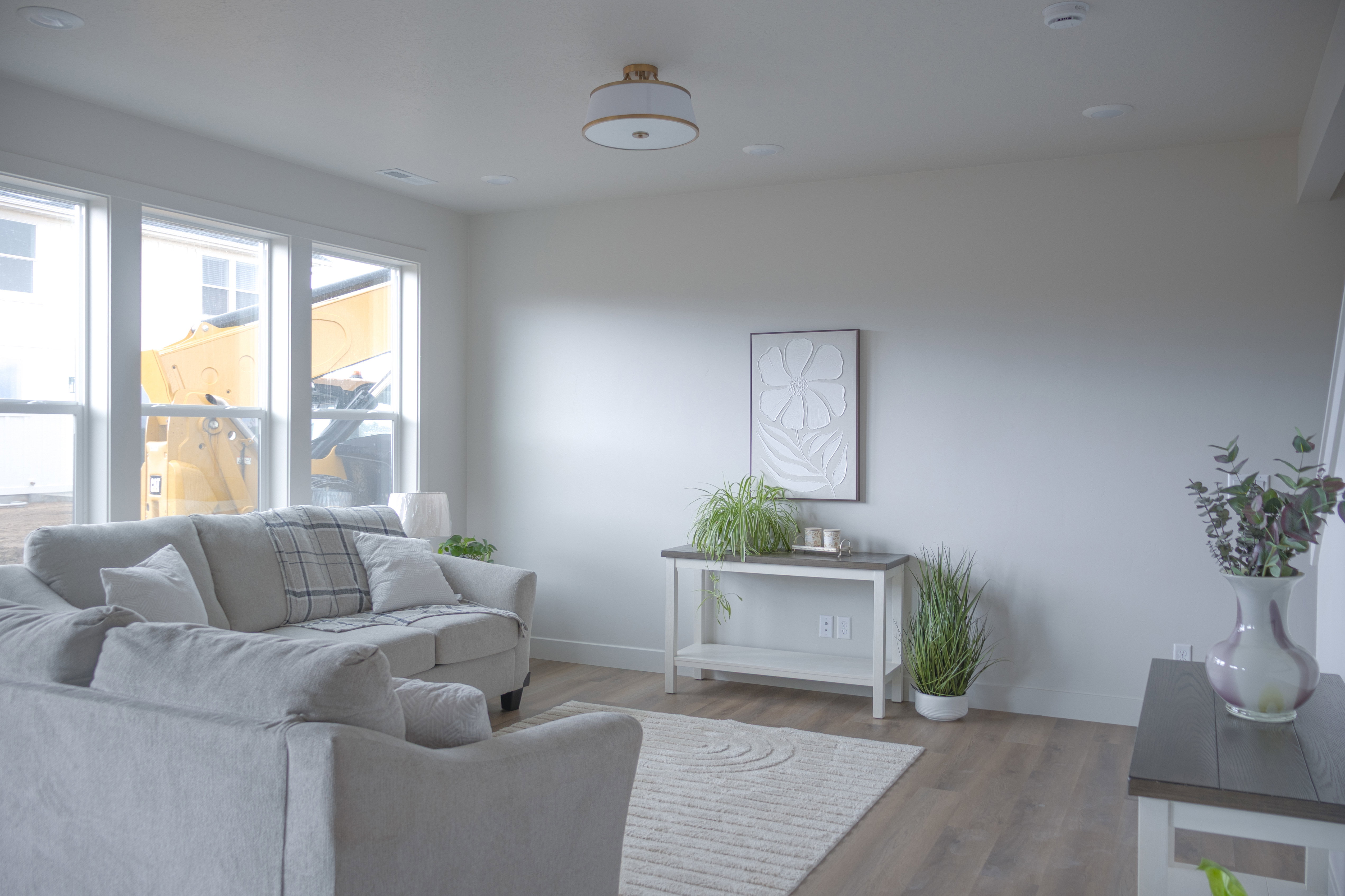 Living area featuring baseboards and wood finished floors
