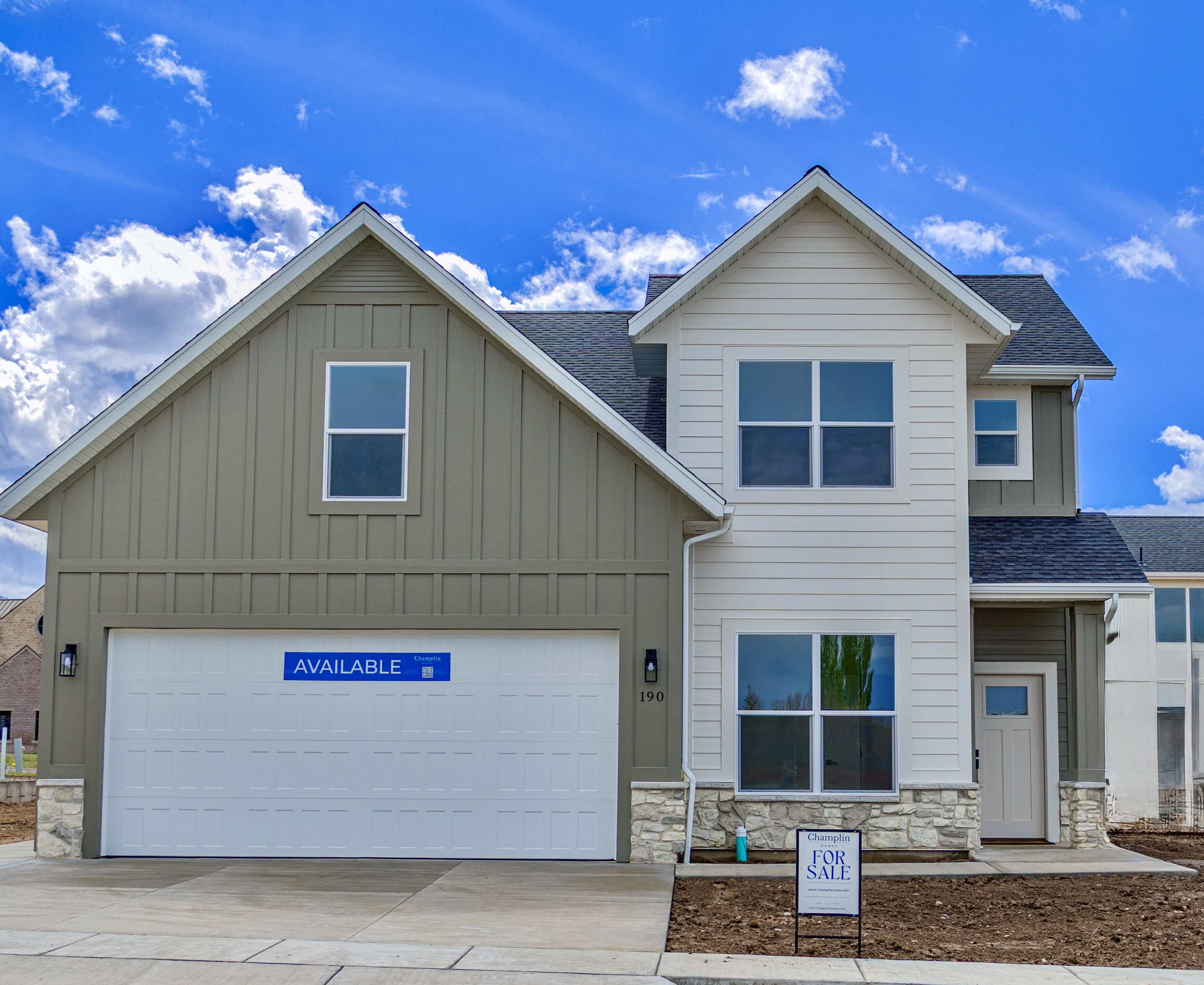 Contemporary two-story residence featuring a combination of horizontal siding and board-and-batten accents