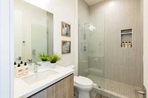 Bathroom with vanity and walk in shower