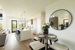 Dining space featuring light wood-style flooring and recessed lighting