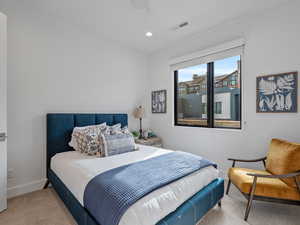 Carpeted bedroom featuring recessed lighting and ceiling fan