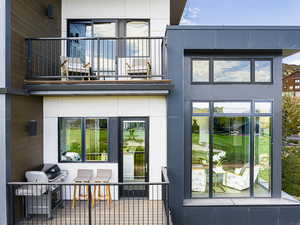 Rear view of house featuring a balcony