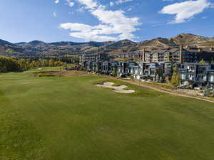 Surrounding community with a mountain view and golf course view