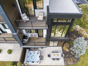 Back of property with a patio and a balcony