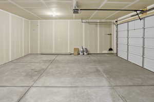 Garage featuring a garage door opener