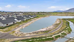 Aerial view of residential area featuring a water and mountain view