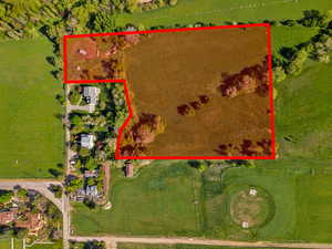 Aerial view of sparsely populated area with property boundaries highlighted