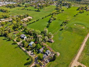 Aerial view of property and surrounding area featuring rural landscape
