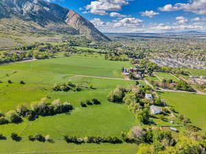 Aerial view of sparsely populated area with mountains and a pastoral area