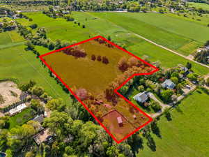 Aerial view of sparsely populated area featuring property boundaries highlighted