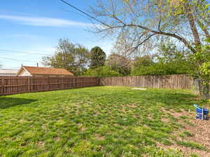 View of fenced backyard