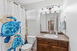 Full bath featuring vanity and a shower with curtain