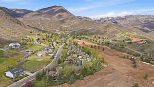 Aerial view of residential area featuring a mountainous background