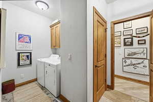 Laundry area with cabinet space and washer and dryer