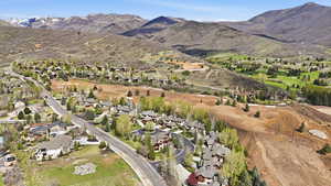 Aerial perspective of suburban area with a mountain backdrop