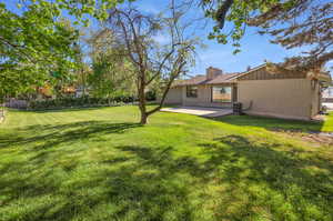 View of yard with a patio