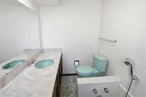 Bathroom with toilet and vanity