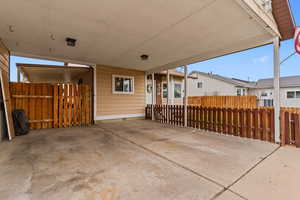 View of patio / terrace featuring a carport
