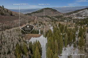 Aerial overview of property's location featuring mountains and property parcel outlined