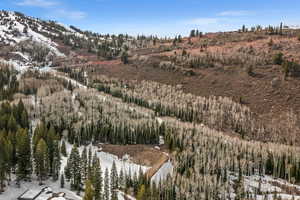 Snowy aerial view featuring a mountain view